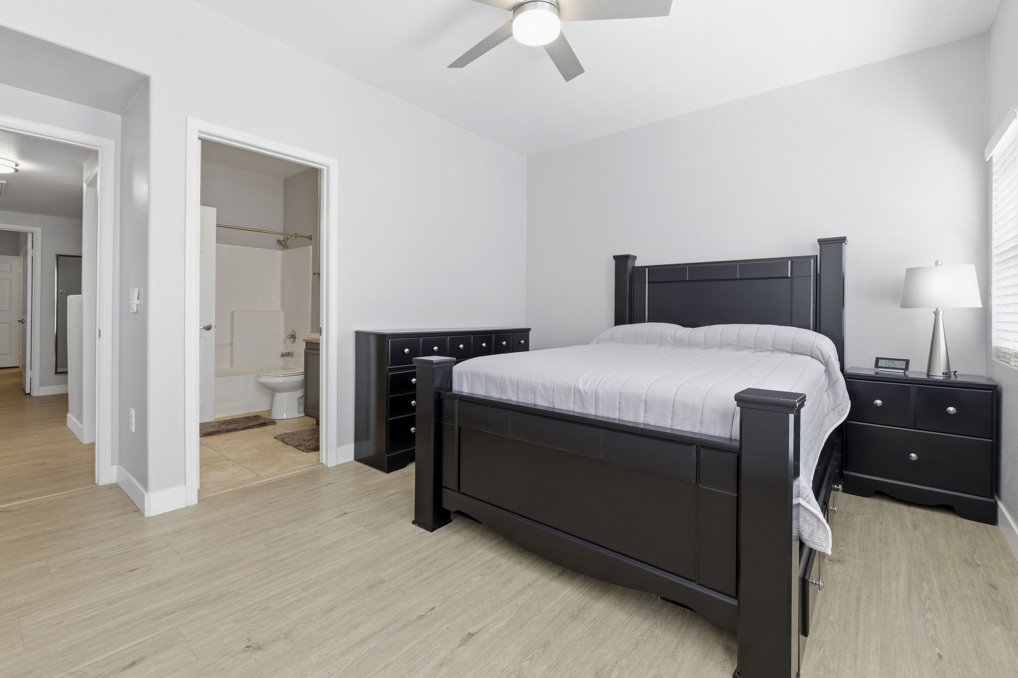 Roomy secondary bedroom connects to full bath.