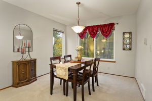 Formal dining with views to the backyard.