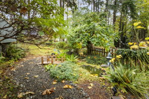Garden paths meander through the property and gardens!