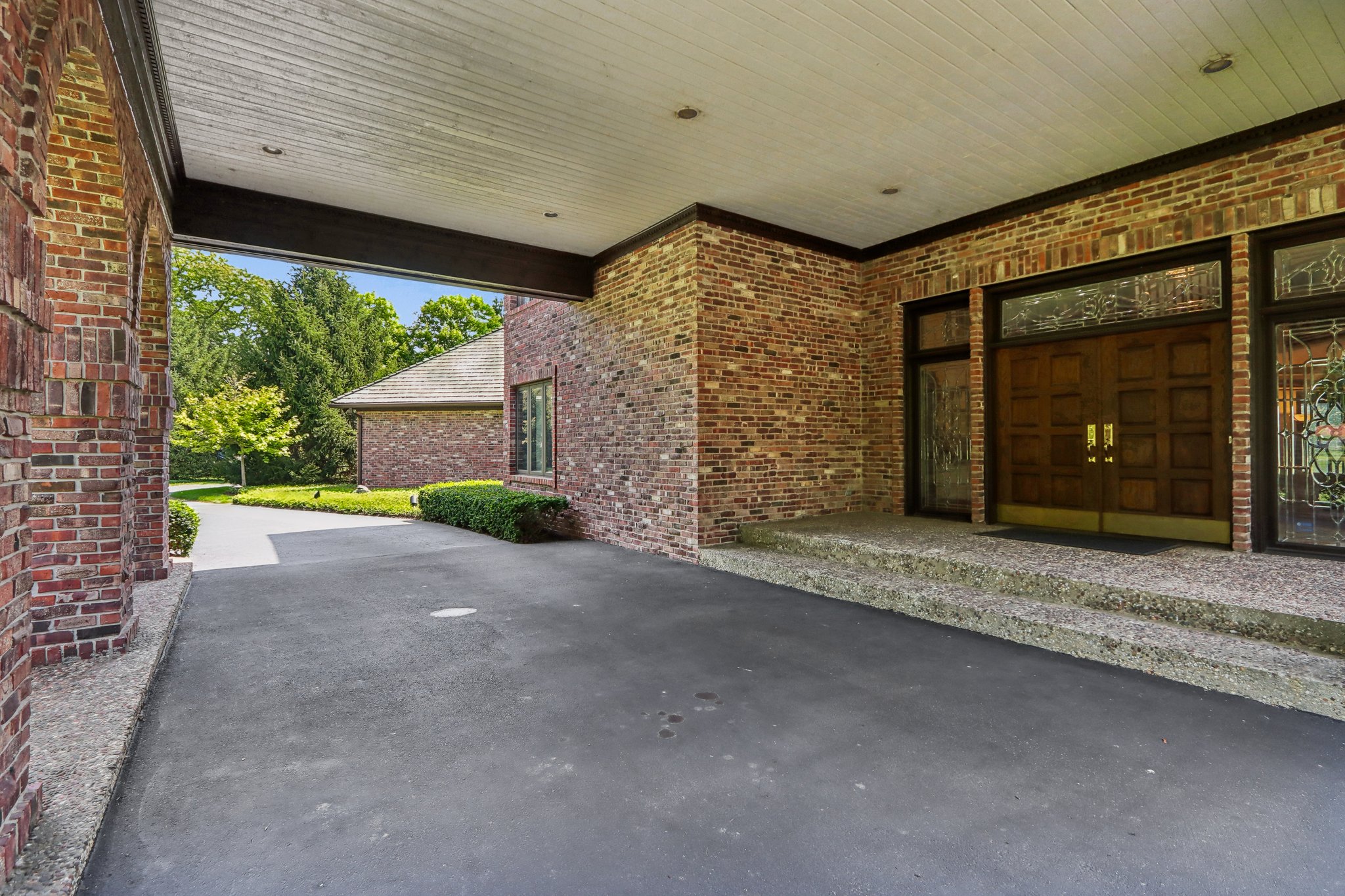 Porte-cochere covered entry at front door