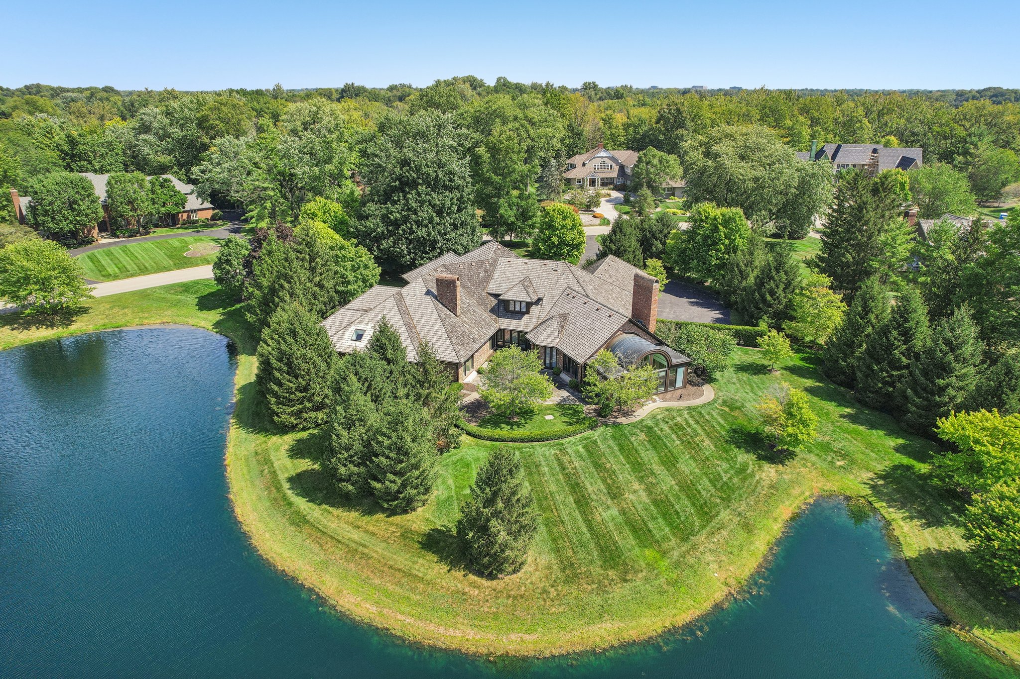 Your very own peninsula! Gorgeous pond on 2 sides of the home