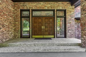 Very impressive and oversized front door with leaded glass surrounds