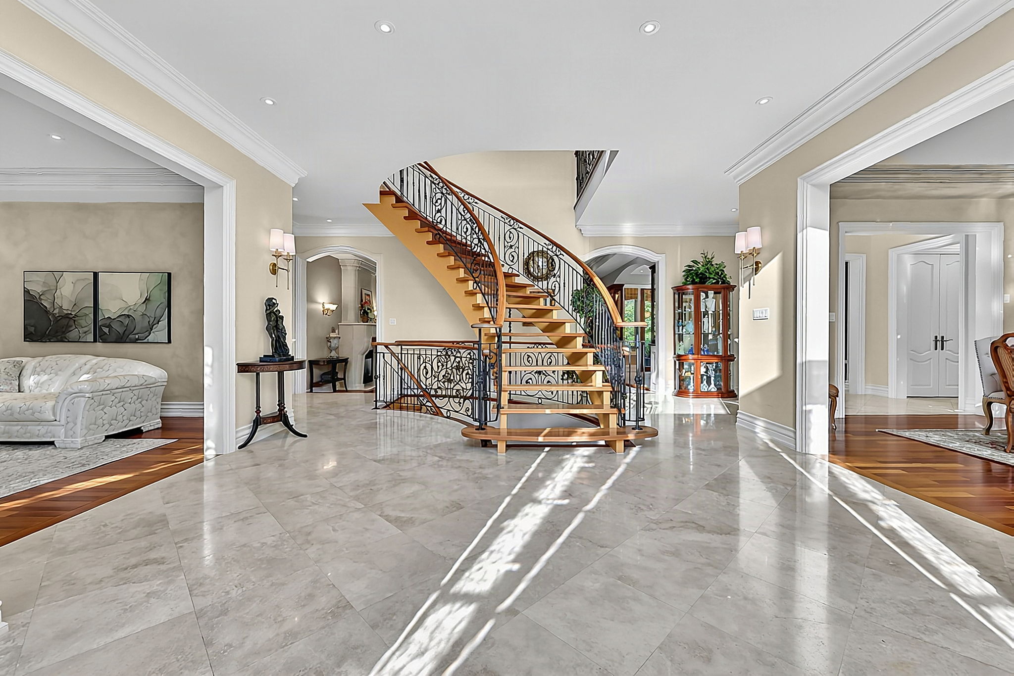 Light-filled Foyer with Limestone Flooring