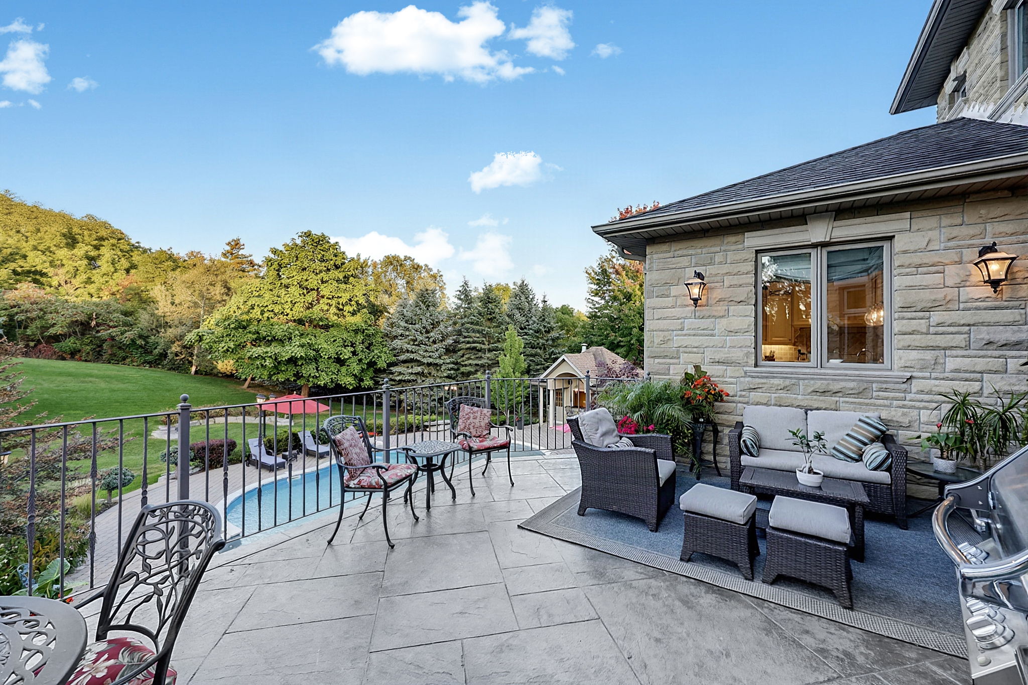 Deck and Living Areas Overlook a Resort-Like Back Yard