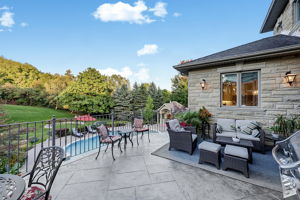 Deck and Living Areas Overlook a Resort-Like Back Yard
