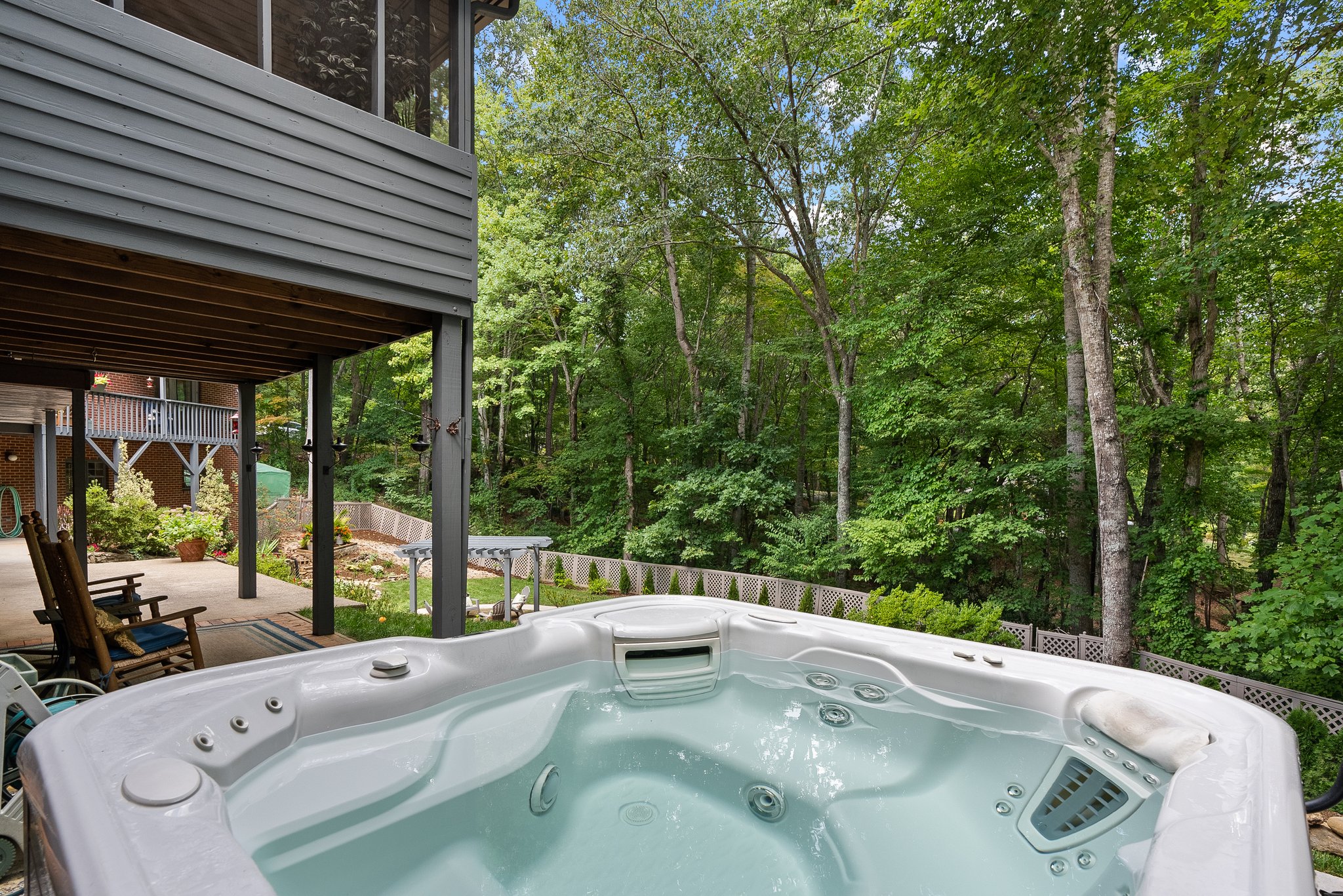 View from the Hot Tub into the Backyard and Woodsline