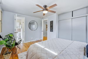 Primary bedroom with shared bathroom en-suite