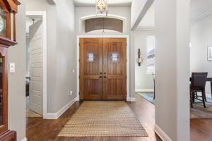 Front entry with Knotty Alder 8' doors with speakeasies