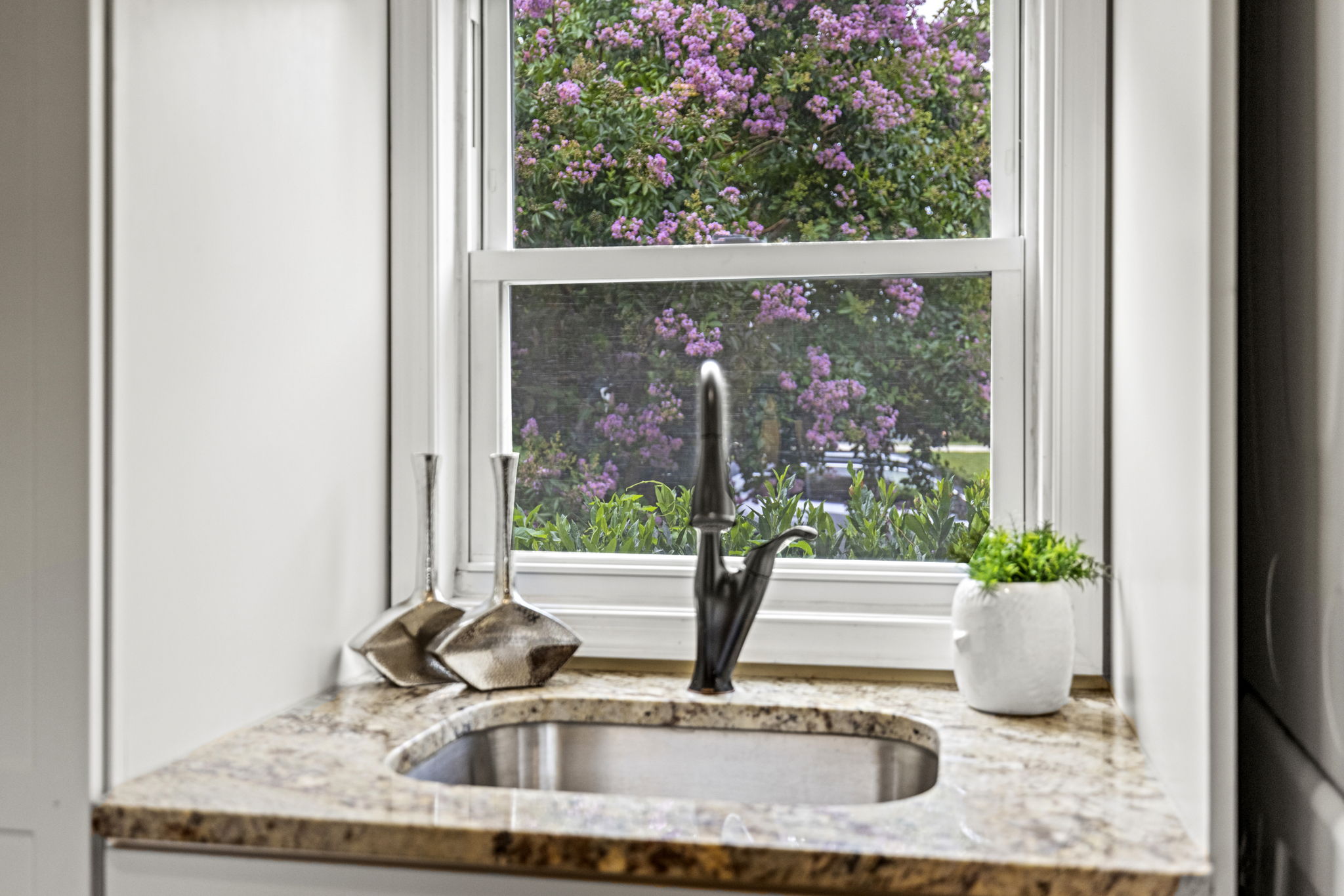 Laundry sink with a pretty view! (View of front yard)