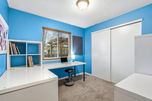 One of two main floor bedrooms which overlooks the backyard