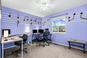 Second of two main floor bedrooms which overlooks the backyard. Do you know what song those music notes represent?
