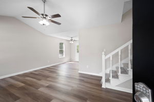 Family room features new paint, new flooring and a new ceiling fans.