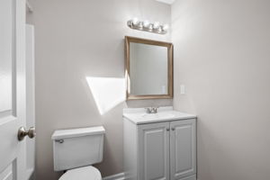 The newly updated bathroom features a new vanity, new paint, new flooring...