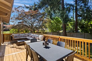 Relax or entertain on the fabulous all NEW deck overlooking the lush, level, fenced backyard.