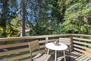 The private balcony has a serene view over the back yard. Enjoy your morning coffee in the sun with mother nature to keep you company.