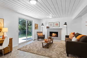 Entertain in the family room with a second cozy fireplace, powder room, and back yard access. There are two fireplaces on opposite sides of the home.