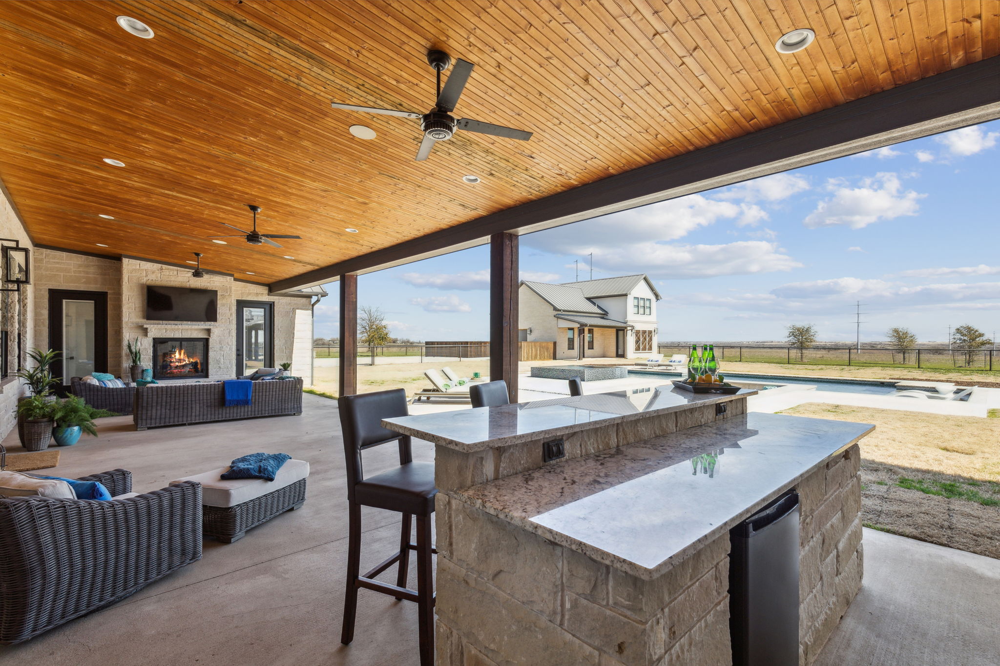 Granite bar with refrigerator on the back patio of the Main Home