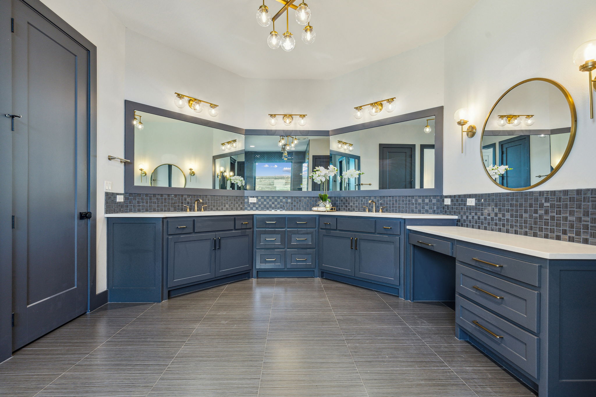 Double sinks and vanity of the Primary Suite bathroom in Main House