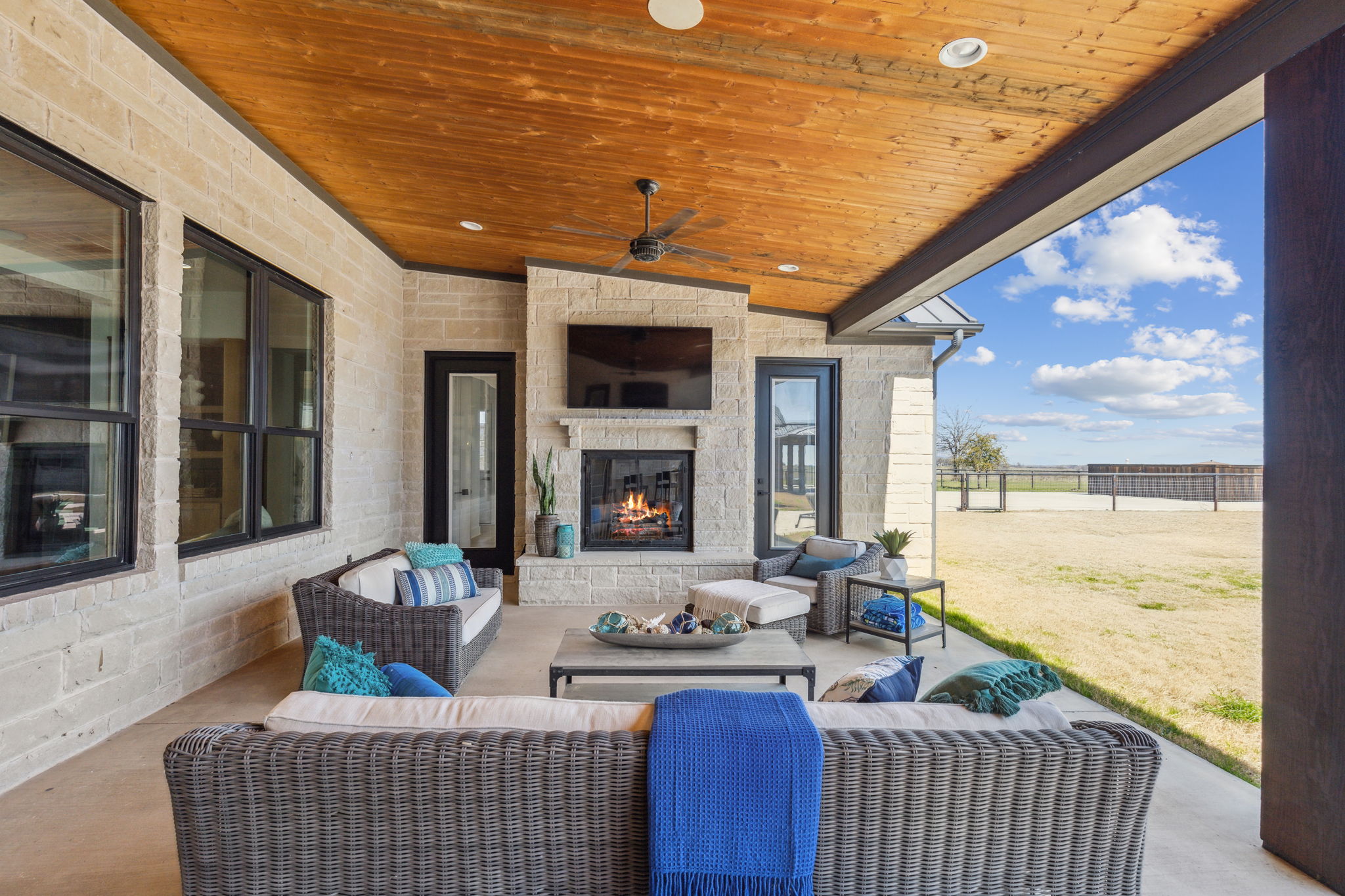 Large screen TV and Fireplace on back patio of the Main Home
