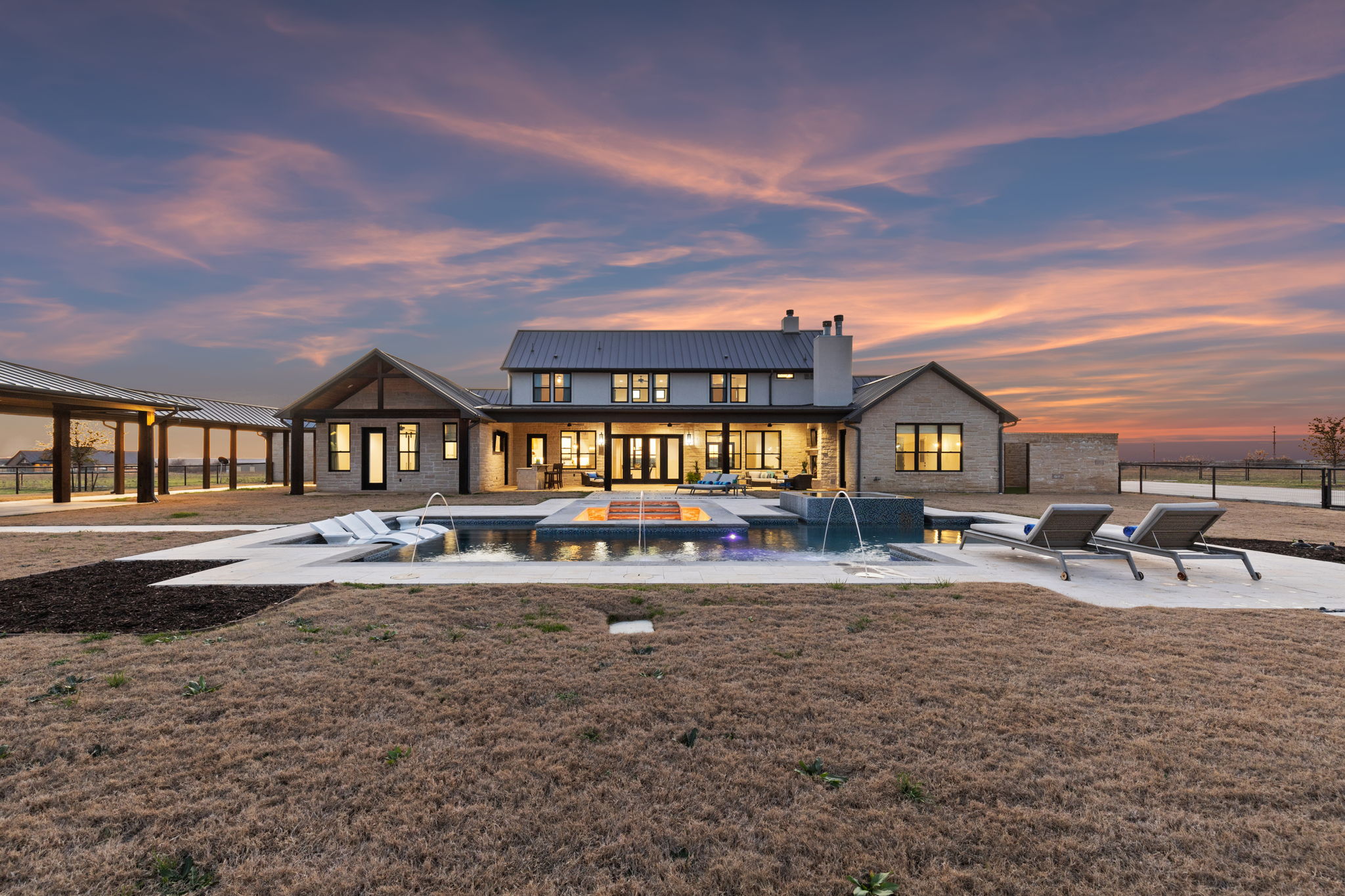 Rear Elevation of the Main Home at twilight