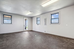 Exercise Room on first floor of the Man Cave with door to a patio