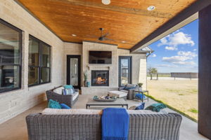 Large screen TV and Fireplace on back patio of the Main Home