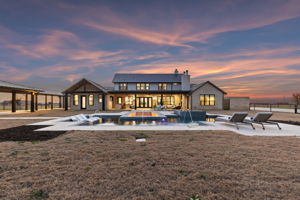 Rear Elevation of the Main Home at twilight