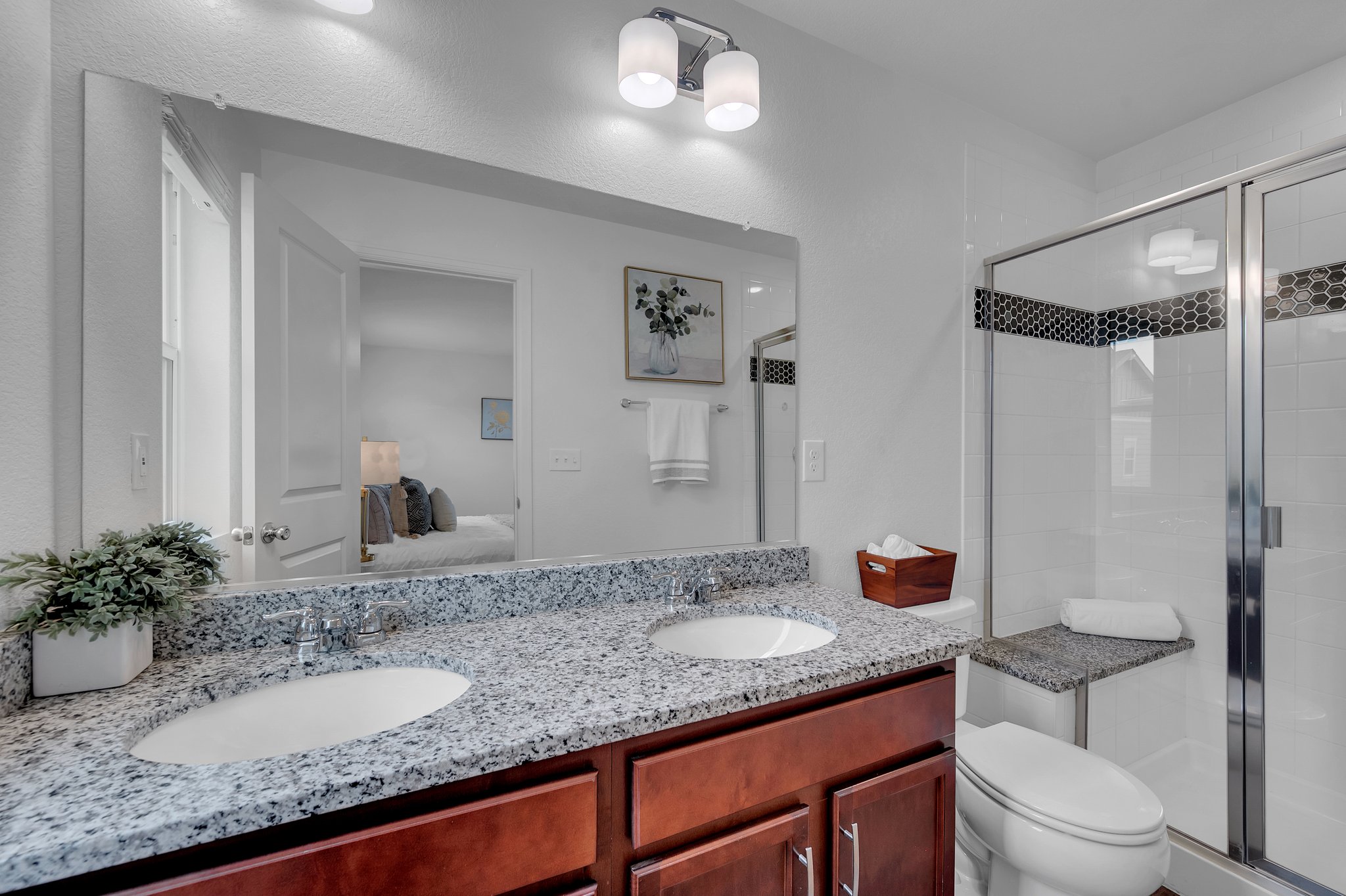 Primary Bathroom with Dual Sink Vanity and Shower