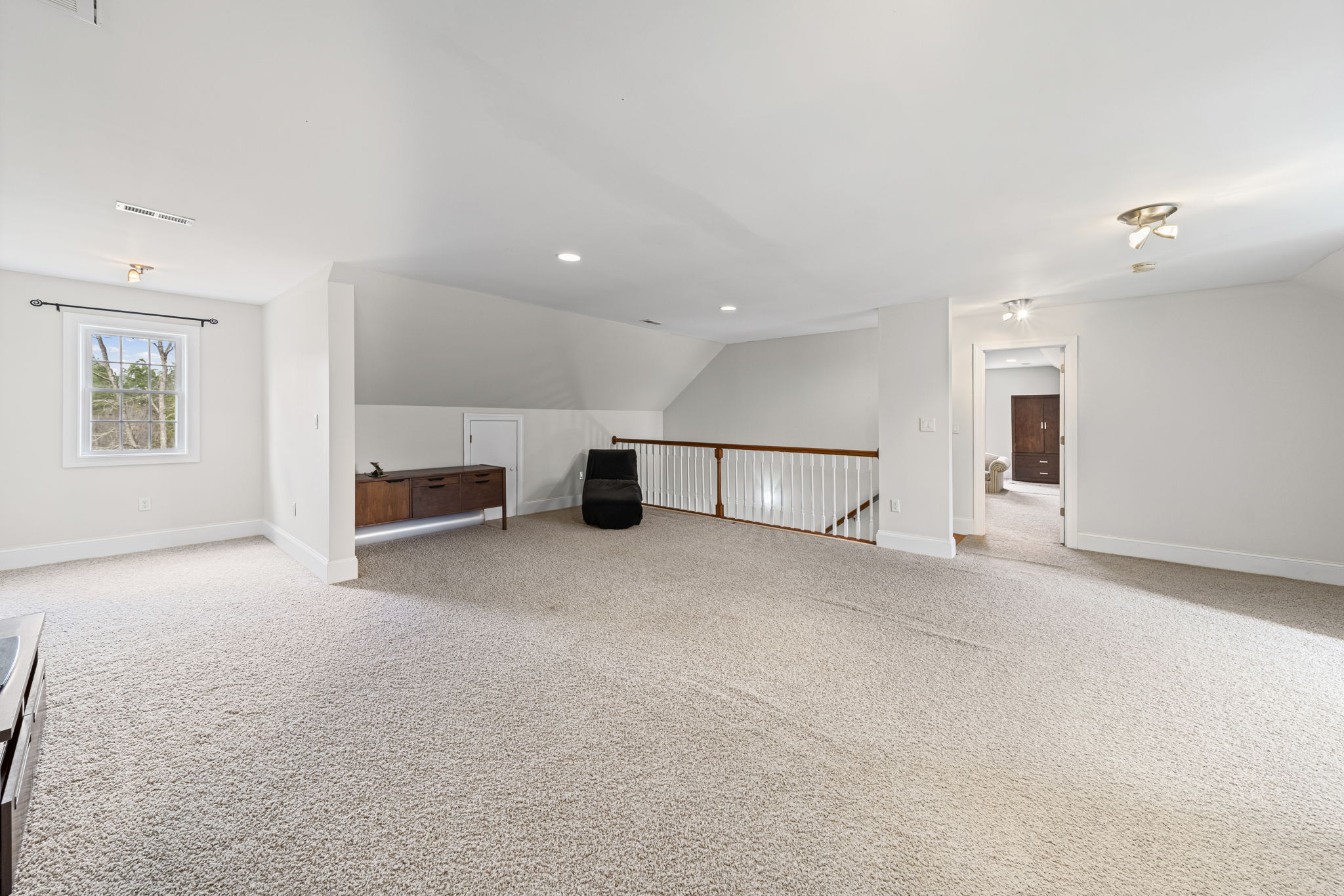 Expansive flex space upstairs looking into the bonus room.