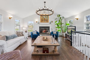 Family Room [With a wood-burning fireplace.]