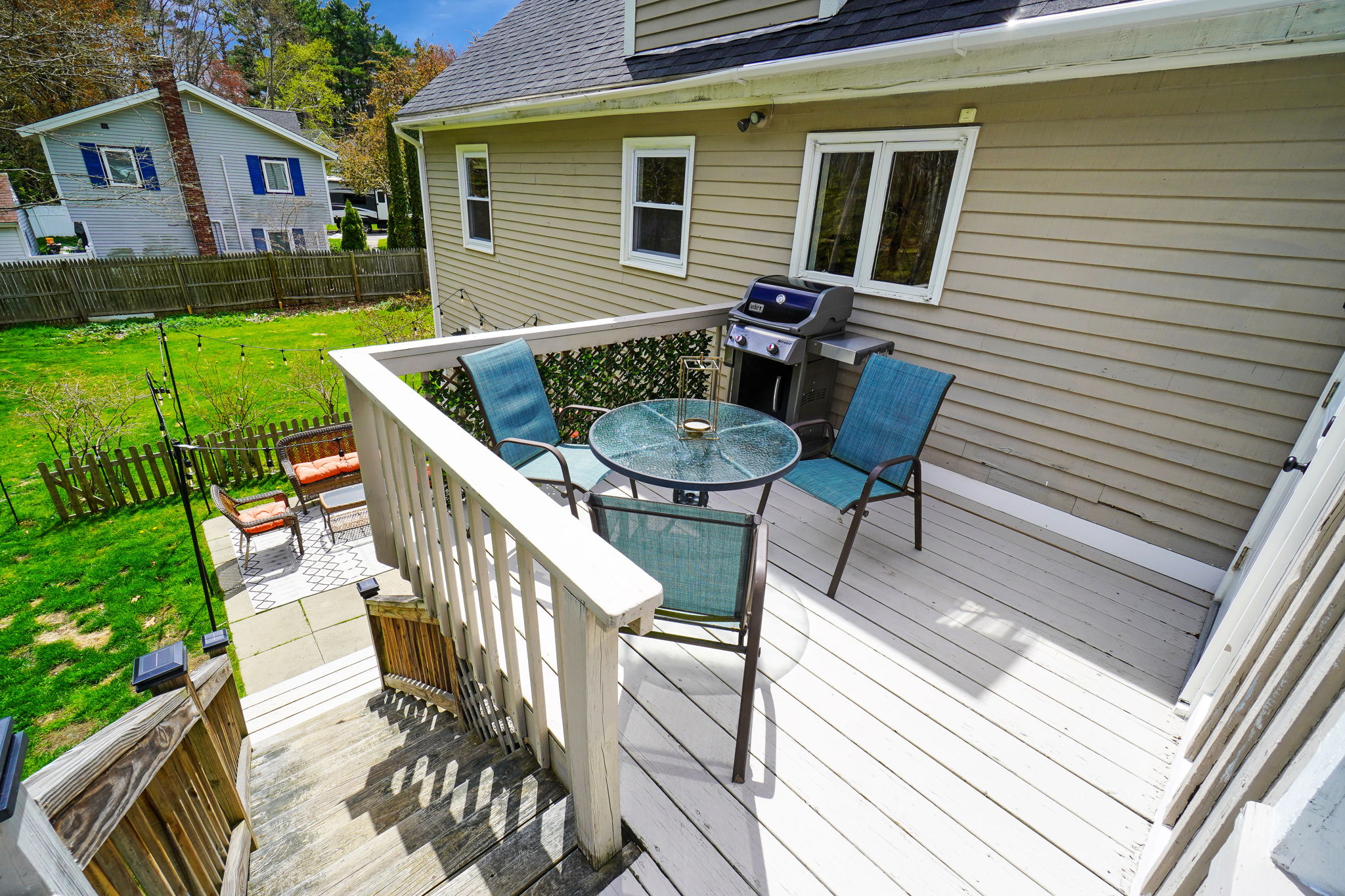 Deck near kitchen, plus patio