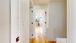 Louvered gate at the top of the stairs