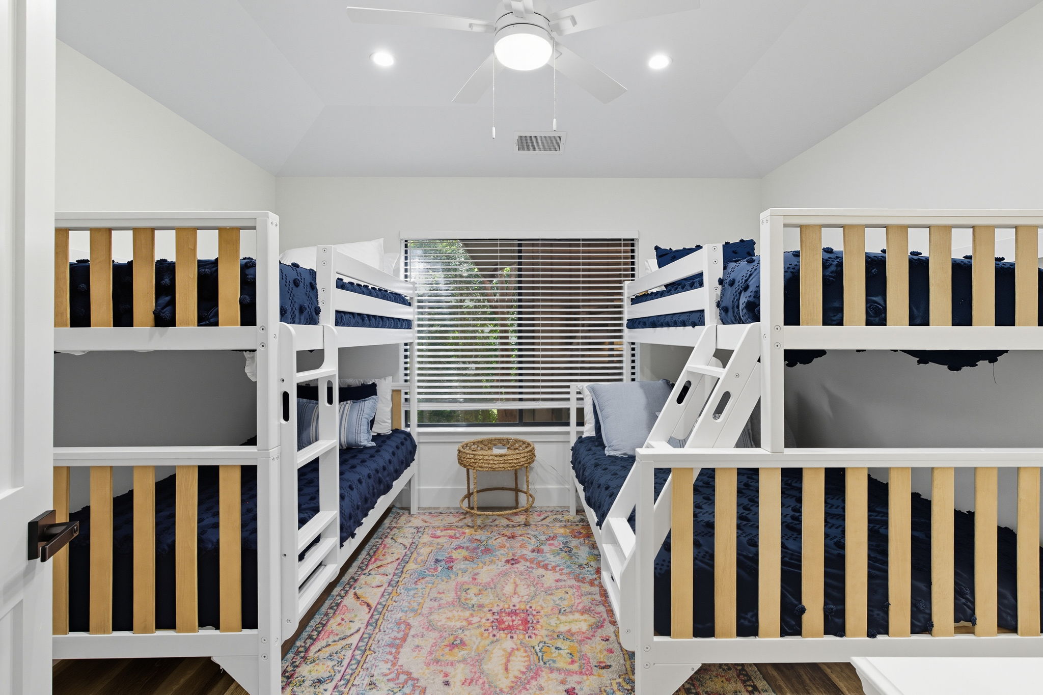 Bunkroom with 3 twin beds and 1 full bed.