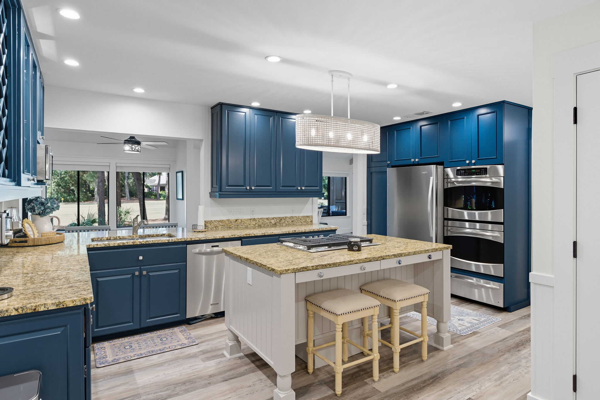 Kitchen with seating @ the island and double ovens.