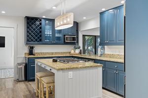 Kitchen with Island and new cooktop.