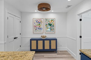 Console for storage and spacious pantry on the left.