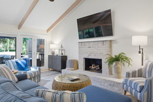 Large flat screen and door to the deck.