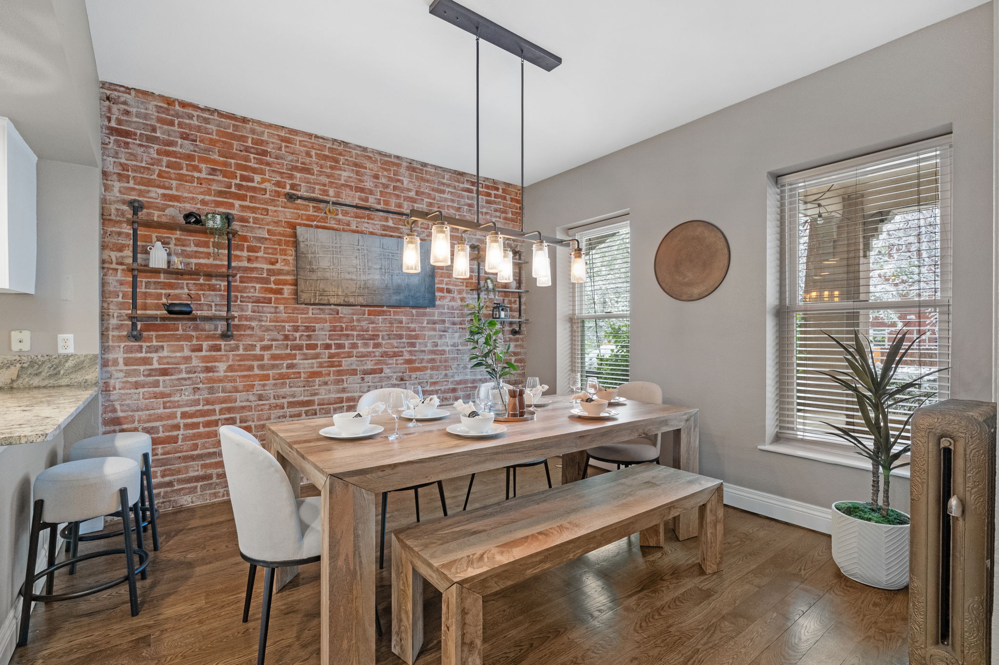 Gorgeous dining room with exposed brick