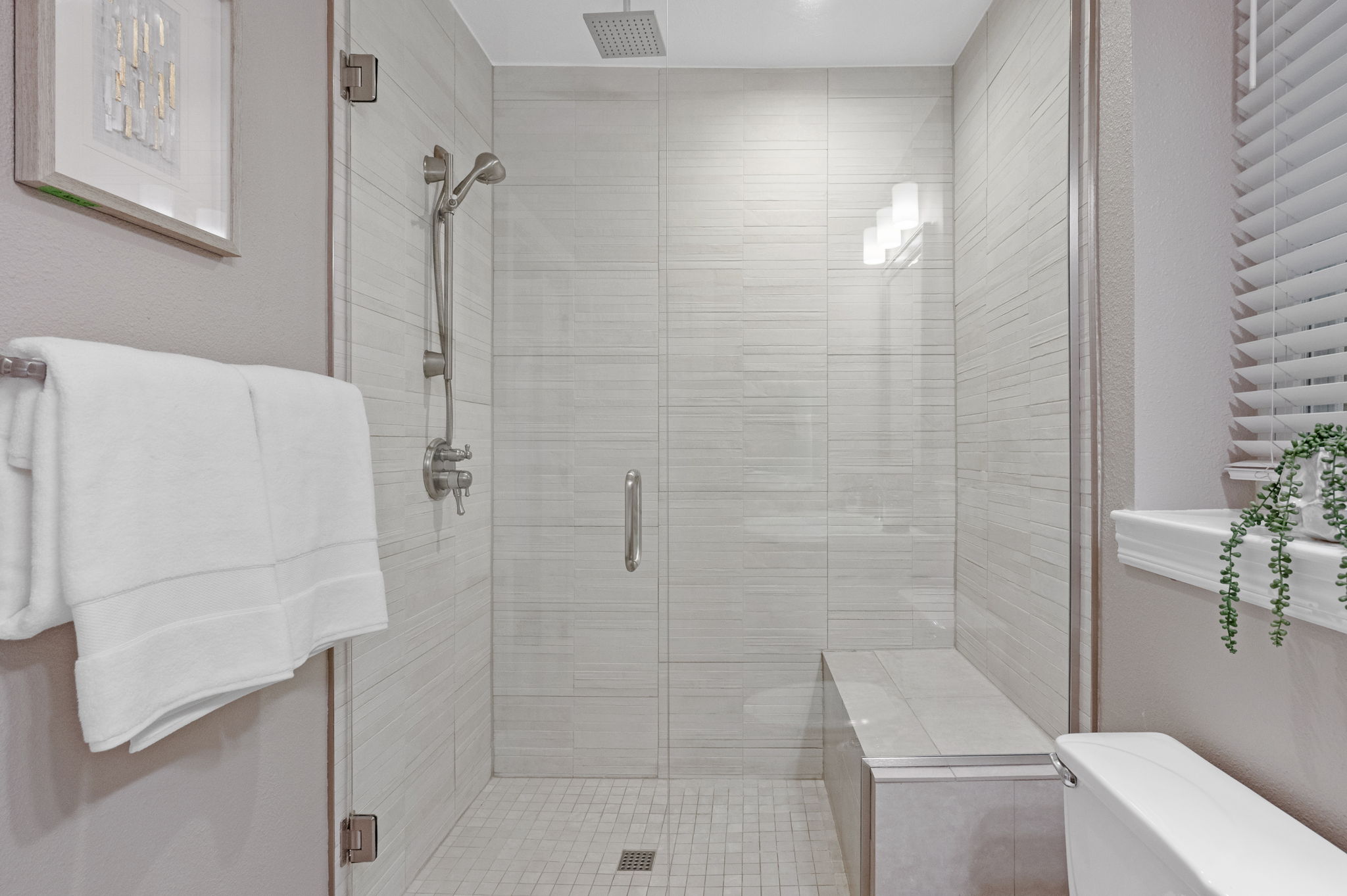 Primary ensuite shower with bench