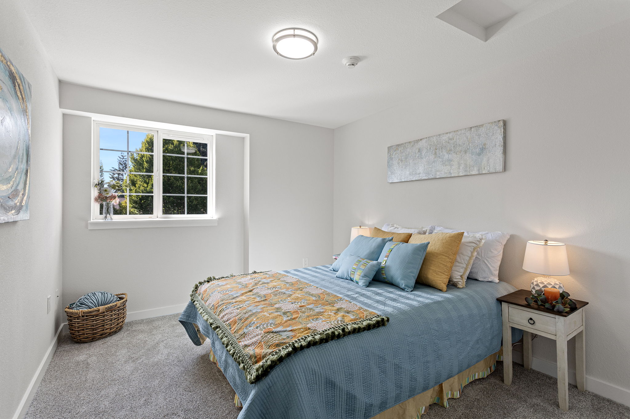 A generous second bedroom gives you options—guest room, home office, or a little of both—with new carpet and padding, new molding, new doors, and west-facing light later in the day.