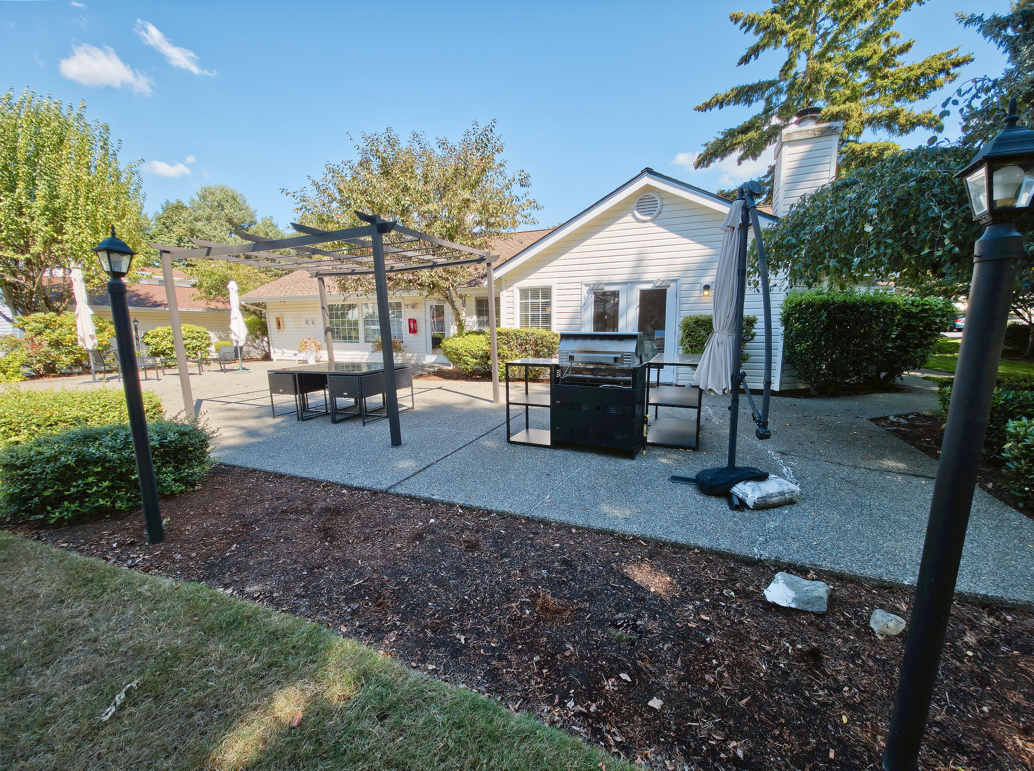A barbecue is provided in the outdoor gathering area, making it easy to cook and gather outside.