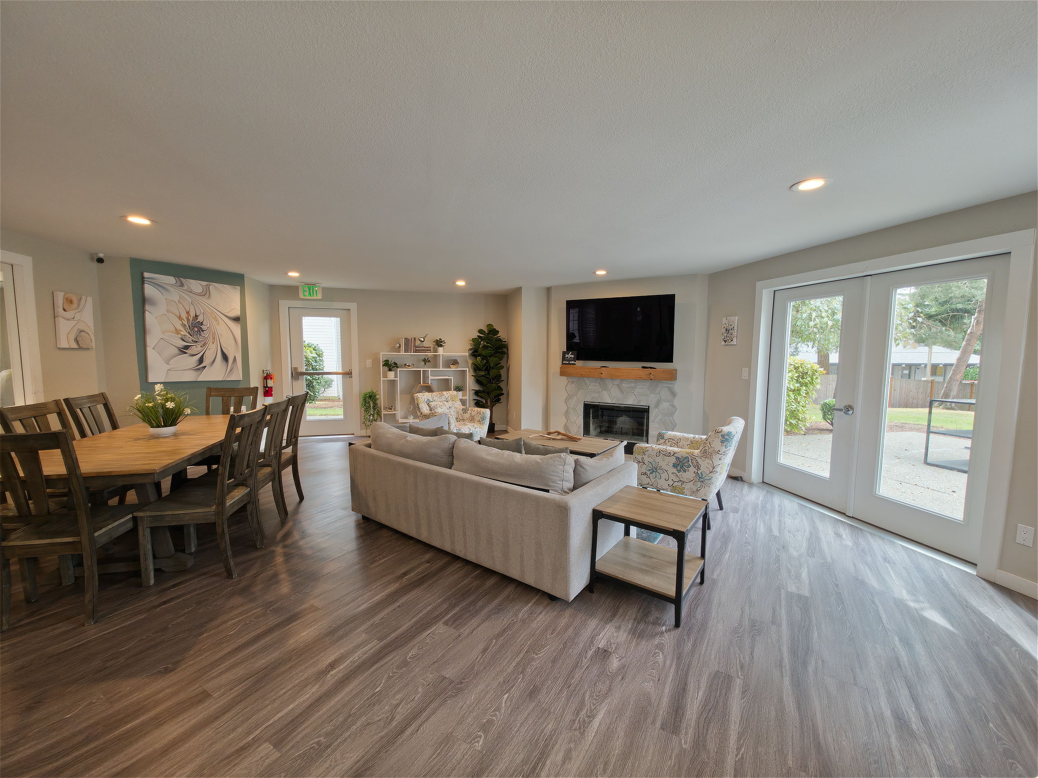 From the kitchen, the open pass-through looks directly into the spacious dining and living area—easy for serving, conversation, and keeping everyone connected.
