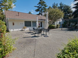 Step outside to a sunny gathering area with room to sit, visit, and extend clubhouse get-togethers into the open air.