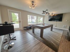 The clubhouse game room gives residents a separate place to shoot pool, watch the game, or just hang out.
