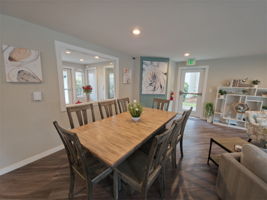 The dining table seats eight comfortably—useful for dinners, game nights, or gatherings that need more room than home.