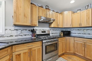 Stainless Appliance with granite counters and gas stove