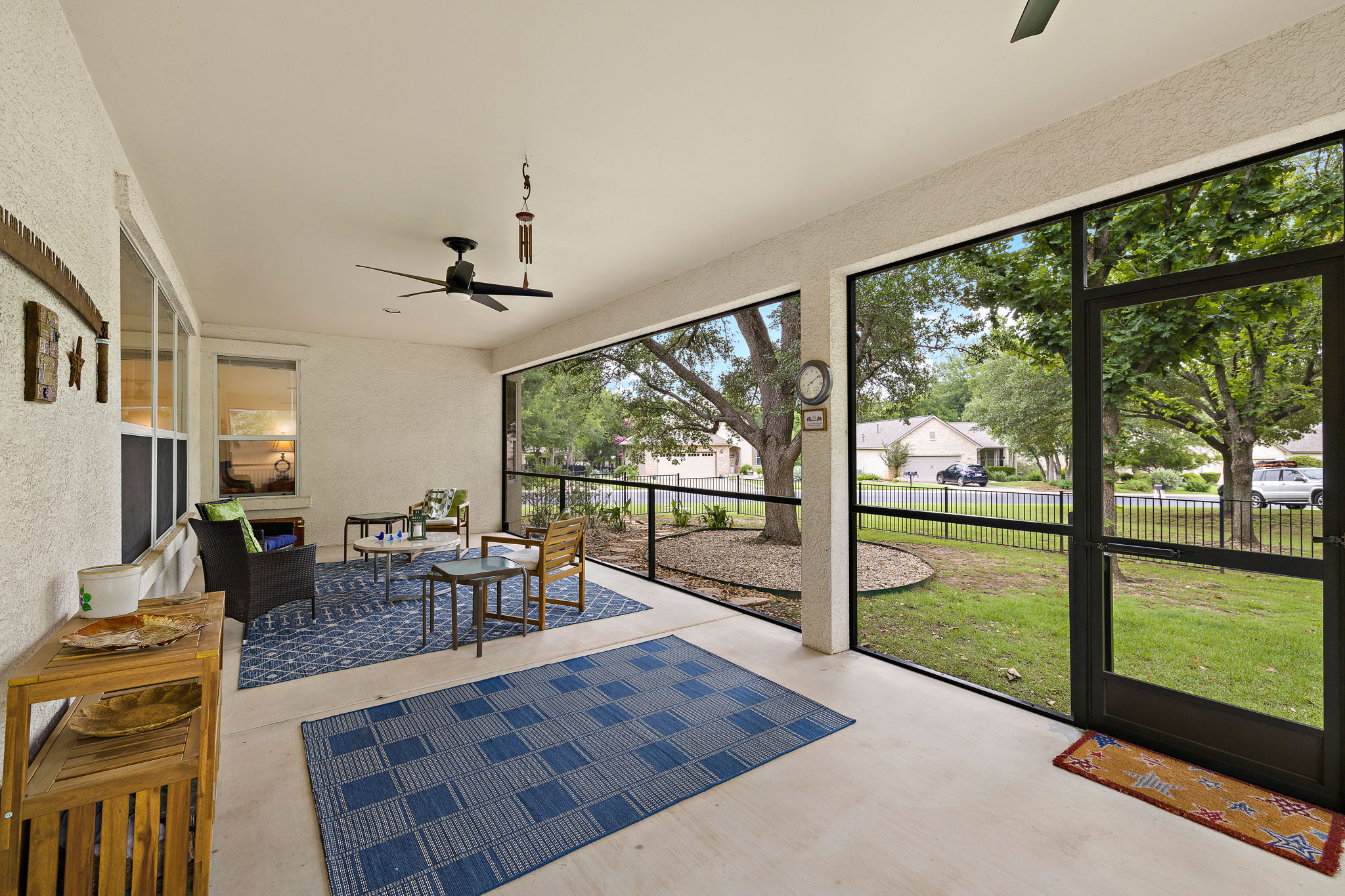 Have your morning coffee on this lovely screened in porch.