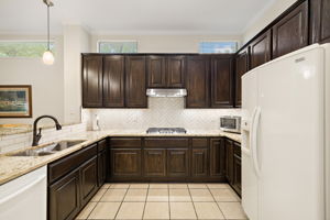 Generous cabinet space with gorgeous granite counter tops