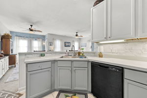 Kitchen w/ Backsplash & Plentiful Cabinetry