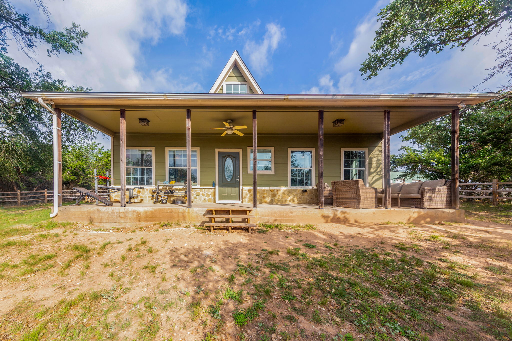 1.4 acre hill country home offers privacy, gorgeous oak trees, warehouse & pet friendly